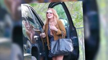 Lindsay Lohan Looks Happy as She Leaves Rehab