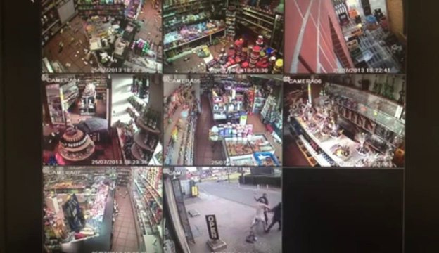 Avorted Hold-Up in a grocery store in Belgium... Impressive defense with wine bottles!!