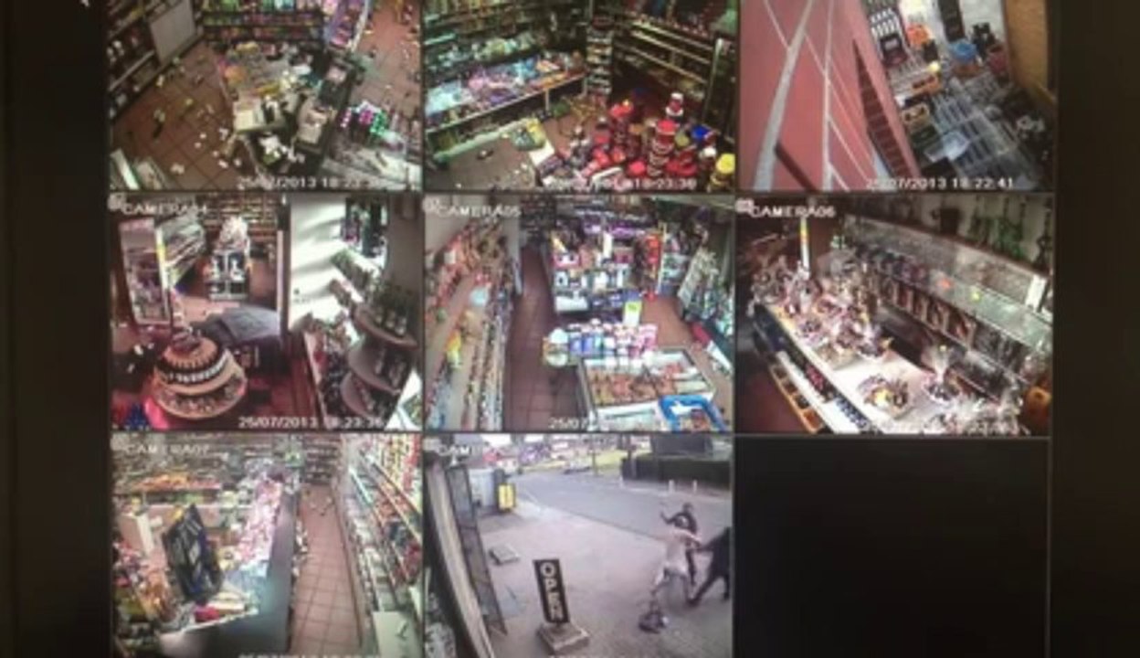 Avorted Hold-Up in a grocery store in Belgium... Impressive defense with wine bottles!!