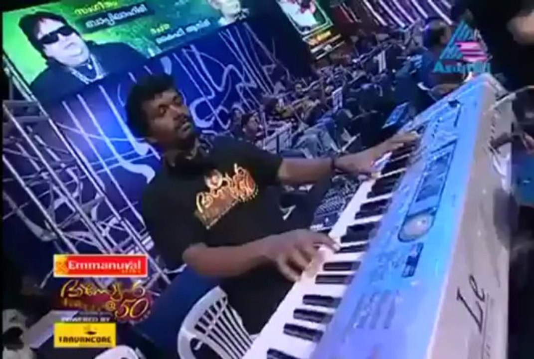 Sonu Nigam with Yesudas singing Mana Ho Tum