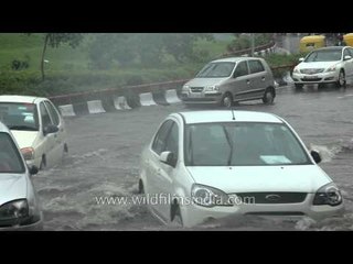 Bus splashes scooterist: Delhi in a flooded civic mess after the rains