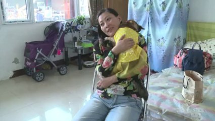 Beijing cop goes off the leash to rescue dogs