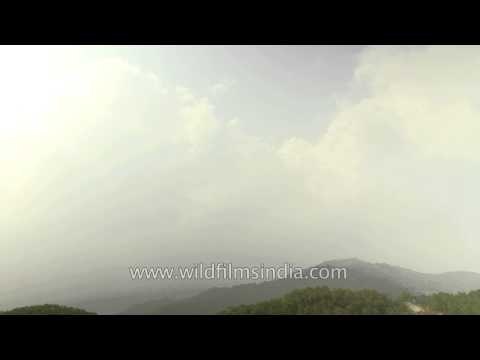 Clouds moving in fast motion over the Annapurna Range on the South of Pokhara Valley