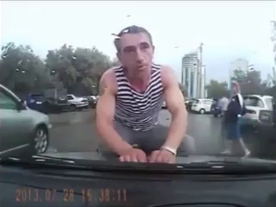 Russian cam - crazy guy jumps on a car!