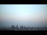 Sunset over high rise buildings in the United States - Time Lapse