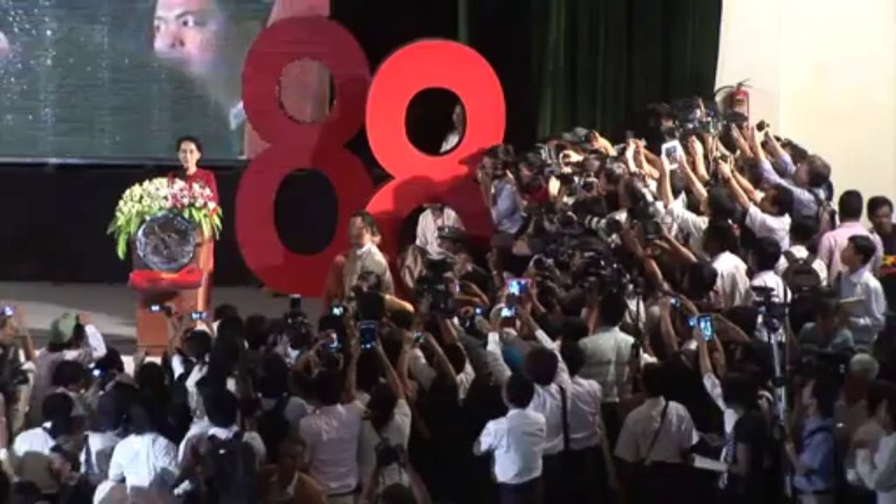 Suu Kyi urges progress while marking Myanmar uprising