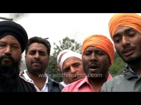 Sikh pilgrims singing spiritual songs during Sri Hemkunt Sahib Yatra