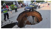 Car Nearly Disappears into Chinese Sinkhole
