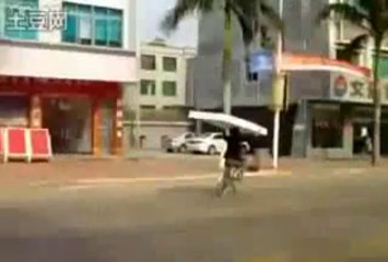 Cyclist Carries A Mattress On His Head