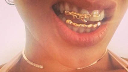 Rihanna has bling on her Teeth in the form of a gun - Tasteless or Hot?