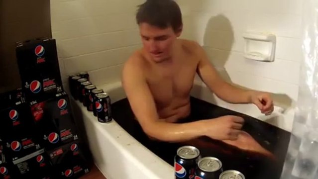 Crazy guy takes 500 cans of Pepsi Cola bath!! Strange way to relax after a hard working week...