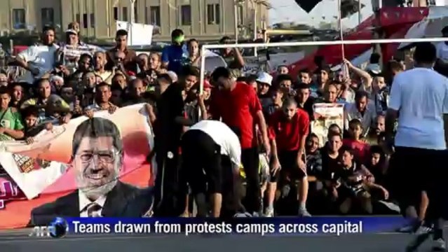Morsi backers hold football match amid protests