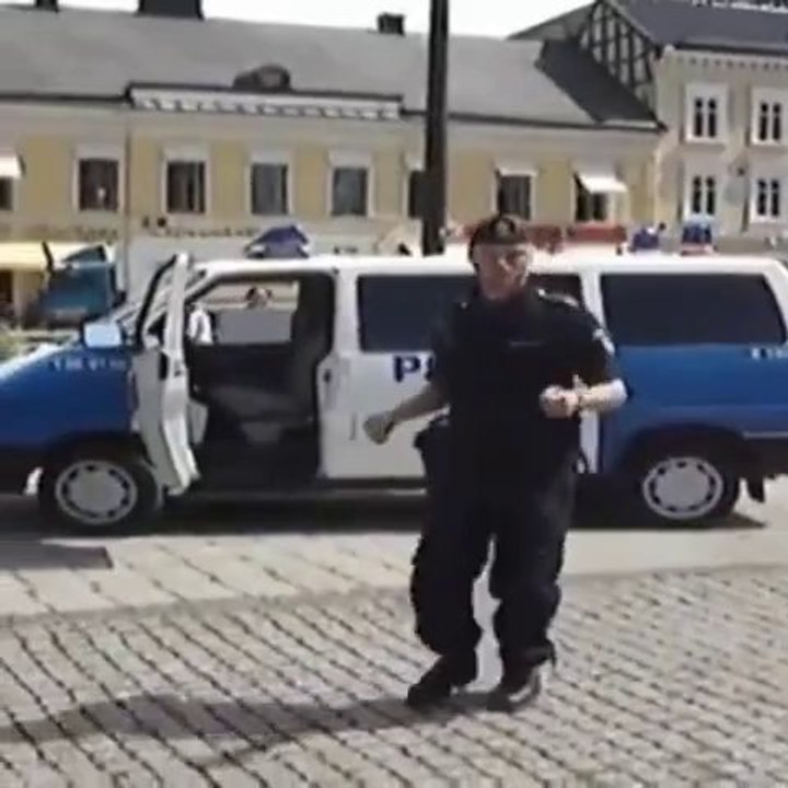 Policeman dancing on Spice Girls song Wannabe...