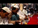Devotees observing Iftar at Nizamuddin Dargah