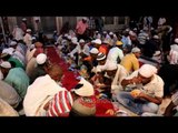 Muslim devotees eating food during Iftar at Hazrat Nizamuddin Dargah