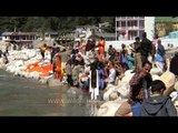 Devotees in spiritual trance on the bank of river Ganga in Gangotri