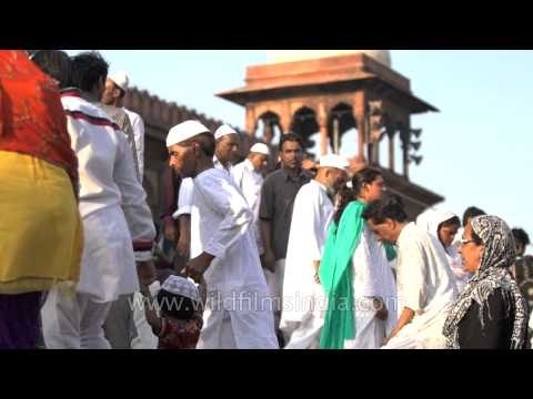 Muslim devotees coming out of the grand Jama Masjid in Slow motion