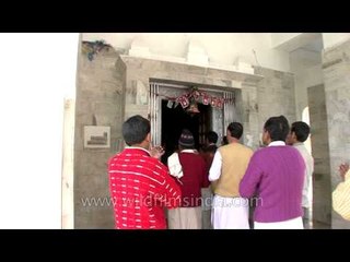 Devotees sing in praise of Goddess Ganga amidst the beat of drums