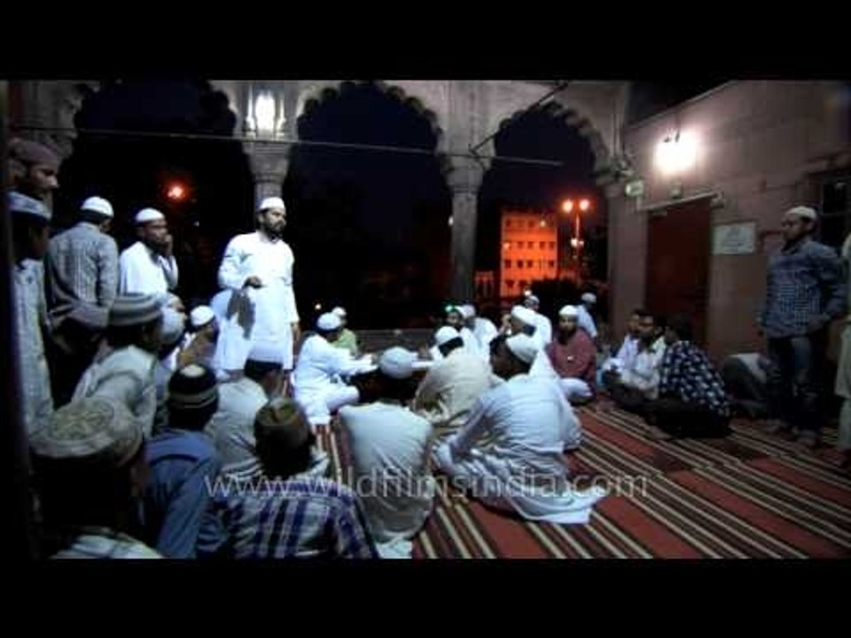 Devotees after namaz Maghrib in Jama masjid on the eve of Eid al Fitr