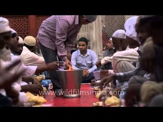 Sharbat being served for Iftar at Nizamuddin Dargah
