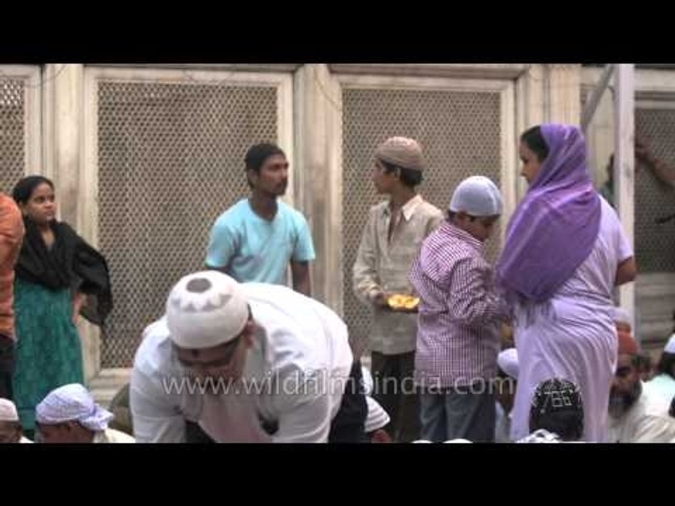 Serving food to the fasting people during Iftar at Nizamuddin Dargah