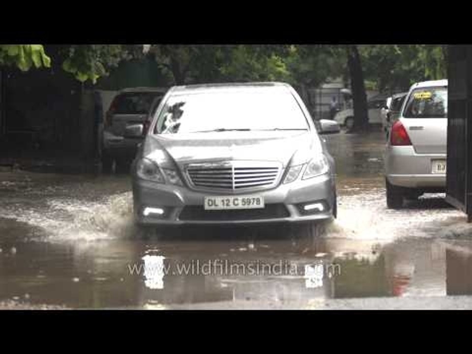 Mercedes E class wades through Delhi's monsoon flooded streets