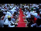 Fasting Muslims performing Iftar at Nizamuddin Dargah