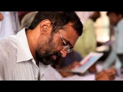 That looks like Rahul Gandhi filling out his Income Tax returns at the IT office?