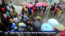 Philippines mops up after deadly floods