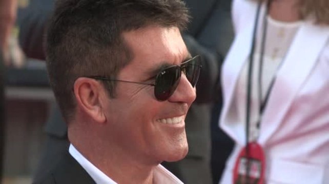 Simon Cowell Reveals He's 'Proud' To Be a Dad at One Direction Film Premiere