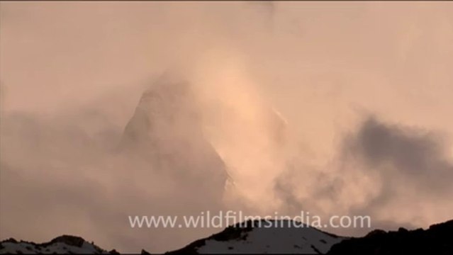 1734.Shivling and swirling clouds at sunset!