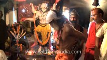 2300.Baba doing yoga asan in Bhoothnath cremation ground