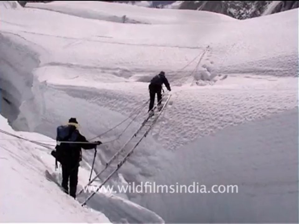 2512.Climbers crossing a crevasse