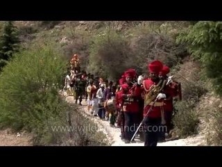 Army band marches along, in obeisance to maa Ganga