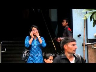 A boy distributing leaflets in India