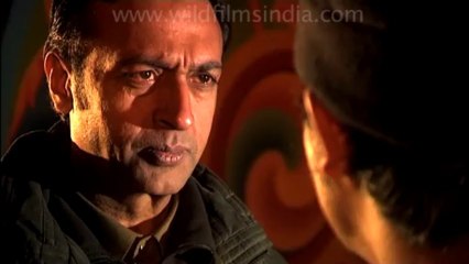 Police talking to tibetan boy