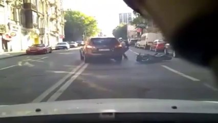 Download Video: Motorcycle accident. The driver hit a car door while it was open.