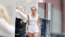 Miley Cyrus Rocks Pig Tails in the Rain