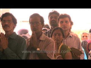 Devotees stare at the camera at Birla Mandir on Janmashtami