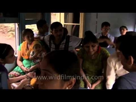 Passengers travelling on the Matheran train near Mumbai