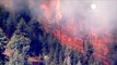 Weather and drones aid firefighters battle California...