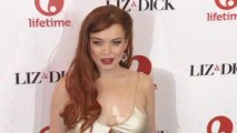 Lohan avoids Venice, Cage premieres there