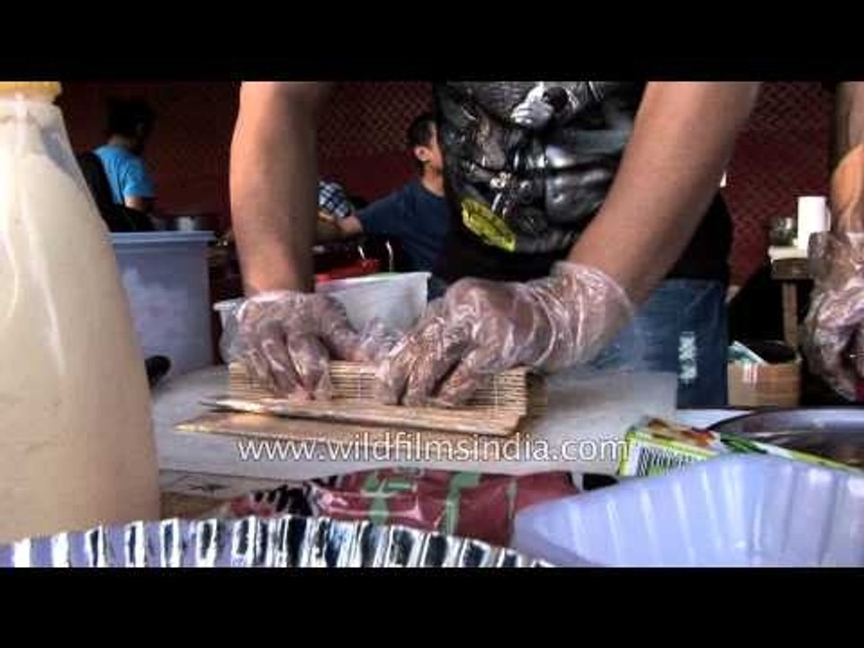 Volunteer makes rolls