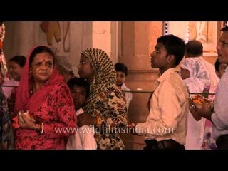 Devotees line up to celebrate the birth day of Krishna at Birla Mandir