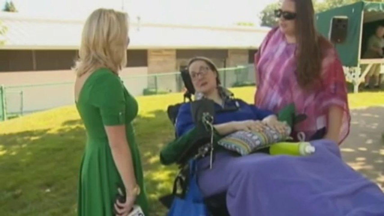 Paralyzed woman controls robot arm