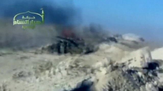 Tanks burn, bodies lie in Syrian town of Maaloula -amateur video