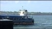 Tourist boat passes by Kanyakumari temple