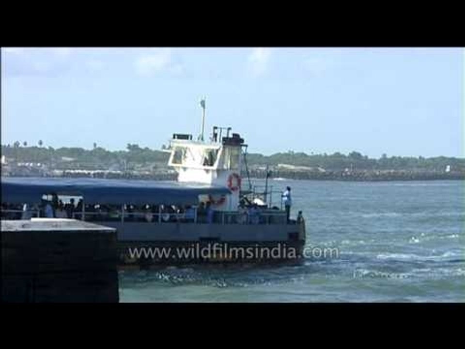 Tourist boat passes by Kanyakumari temple