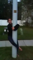 Girl screams at street light then dances on it