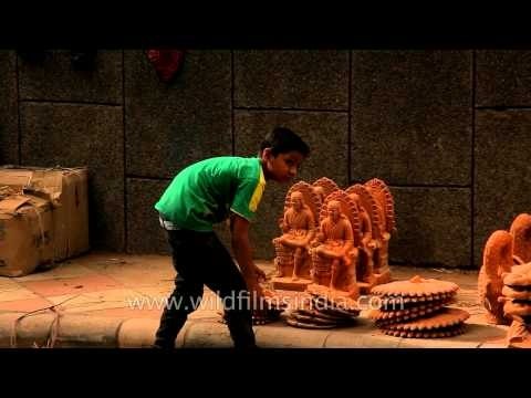 Little kids putting pottery goods for display in Sarojini Nagar
